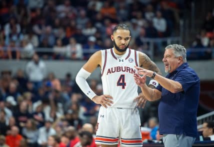 Auburn Tigers head coach Bruce Pearl talks with forward Johni Broome (4) as Auburn Tigers takes on Ole Miss Rebels at Neville Arena in Auburn, Ala., on Saturday, Jan. 20, 2024. Auburn Tigers defeated Ole Miss Rebels 82-59.