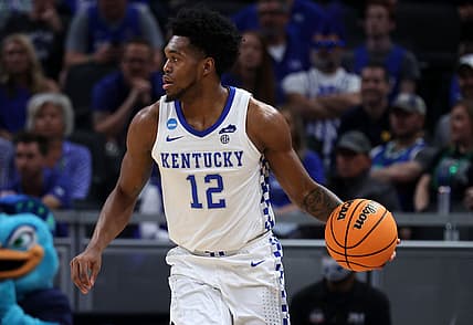 Mar 17, 2022; Indianapolis, IN, USA; Kentucky Wildcats forward Keion Brooks Jr. (12) dribbles the ball against the Saint Peter's Peacocks during the first round of the 2022 NCAA Tournament at Gainbridge Fieldhouse. Mandatory Credit: Trevor Ruszkowski-USA TODAY Sports