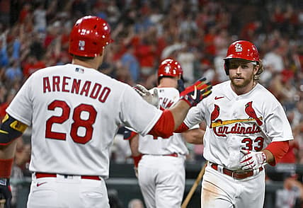 Sep 6, 2022; St. Louis, Missouri, USA;  St. Louis Cardinals third baseman Brendan Donovan (33) is congratulated by designated hitter Nolan Arenado (28) after hitting a solo home run against the Washington Nationals during the fourth inning at Busch Stadium. Mandatory Credit: Jeff Curry-USA TODAY Sports