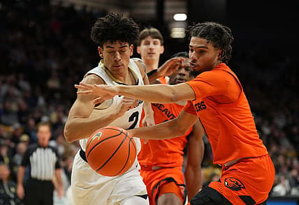 Jan 7, 2023; Boulder, Colorado, USA; Oregon State Beavers guard Jordan Pope (0) knocks the ball away from Colorado Buffaloes guard KJ Simpson (2) in the first half at CU Events Center. Mandatory Credit: Ron Chenoy-USA TODAY Sports