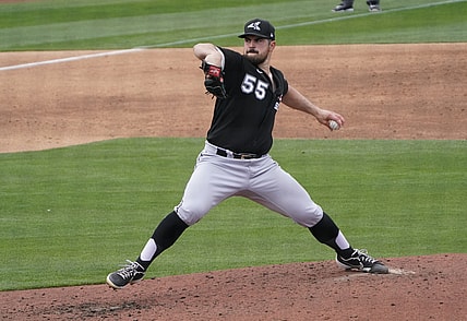 Mar 26, 2021; Phoenix, Arizona, USA; Chicago White Sox starting pitcher Carlos Rodon (55) throws against the Milwaukee Brewers during a spring training game at American Family Fields of Phoenix. Mandatory Credit: Rick Scuteri-USA TODAY Sports