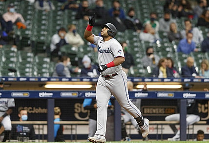 Apr 27, 2021; Milwaukee, Wisconsin, USA;  Miami Marlins first baseman Jes s Aguilar (24) celebrates after hitting a home run during the fourth inning against the Milwaukee Brewers at American Family Field. Mandatory Credit: Jeff Hanisch-USA TODAY Sports