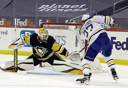 May 8, 2021; Pittsburgh, Pennsylvania, USA;  Pittsburgh Penguins goaltender Maxime Lagace (31) defends a shot by Buffalo Sabres center Casey Mittelstadt (37) during the second period at PPG Paints Arena. Mandatory Credit: Charles LeClaire-USA TODAY Sports