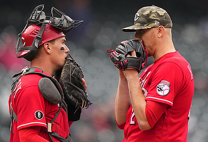 May 16, 2021; Denver, Colorado, USA; Cincinnati Reds starting pitcher Jeff Hoffman (23) and catcher Tyler Stephenson (37) talk on the mound in the fourth inning against the Colorado Rockies  at Coors Field. Mandatory Credit: Ron Chenoy-USA TODAY Sports