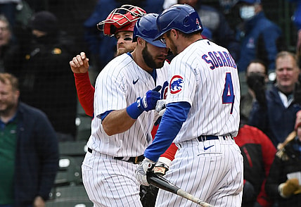 May 28, 2021; Chicago, Illinois, USA;  Chicago Cubs second baseman David Bote (13) is greeted by third baseman Eric Sogard (4) after hitting a home run during the fifth inning against the Cincinnati Reds at Wrigley Field. Mandatory Credit: Matt Marton-USA TODAY Sports