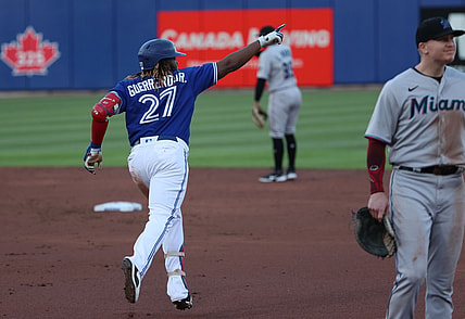 Jun 1, 2021; Buffalo, New York, USA;  Toronto Blue Jays first baseman Vladimir Guerrero Jr. (27) celebrates his home run during the third inning against the Miami Marlins at Sahlen Field. Mandatory Credit: Timothy T. Ludwig-USA TODAY Sports