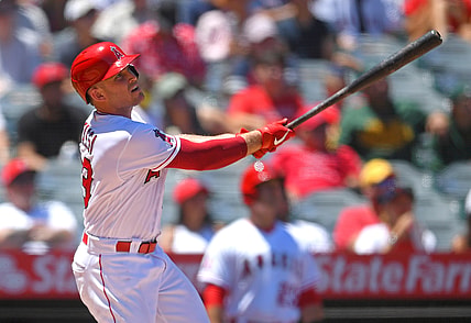 Aug 1, 2021; Anaheim, California, USA; Los Angeles Angels catcher Max Stassi (33) hits a two run home run in the first inning of the game against the Oakland Athletics at Angel Stadium. Mandatory Credit: Jayne Kamin-Oncea-USA TODAY Sports