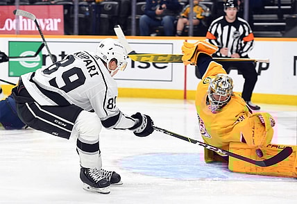 Oct 19, 2021; Nashville, Tennessee, USA; Los Angeles Kings center Rasmus Kupari (89) has a shot blocked by Nashville Predators goaltender Juuse Saros (74) during the second period at Bridgestone Arena. Mandatory Credit: Christopher Hanewinckel-USA TODAY Sports