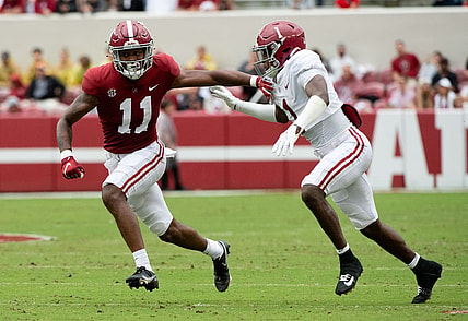 Apr 16, 2022; Tuscaloosa, Alabama, USA;  Crimson wide receiver Traeshon Holden (11) is defended by White defensive back Kool-Aid McKinstry (1) during the A-Day game at Bryant-Denny Stadium. Mandatory Credit: Gary Cosby Jr.-USA TODAY Sports