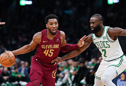 Dec 14, 2023; Boston, Massachusetts, USA; Cleveland Cavaliers guard Donovan Mitchell (45) drives the ball against Boston Celtics guard Jaylen Brown (7) in the first quarter at TD Garden. Mandatory Credit: David Butler II-USA TODAY Sports