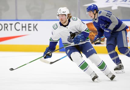 Feb 6, 2021; Toronto, Ontario, CAN;  Vancouver Canucks forward Brock Boeser (6) pursues the play ahead of Toronto Maple Leafs forward Mitchell Marner (16) in the first period at Scotiabank Arena. Mandatory Credit: Dan Hamilton-USA TODAY Sports