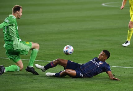 Apr 17, 2021; Nashville, TN, Nashville, TN, USA; Nashville SC goalkeeper Joe Willis (1) kicks the ball away from FC Cincinnati attacker Brenner (9) during the second half at Nissan Stadium. Mandatory Credit: Christopher Hanewinckel-USA TODAY Sports