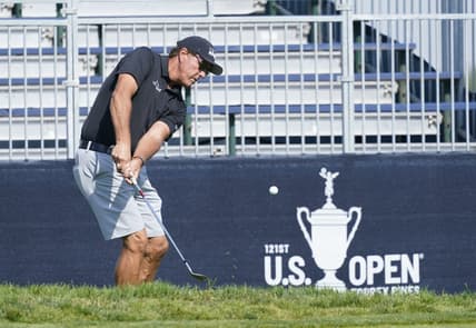 Jun 14, 2021; San Diego, California, USA;Phil Mickelson chips onto the 11th green during a practice round of the U.S. Open golf tournament at Torrey Pines. Mandatory Credit: Michael Madrid-USA TODAY Sports