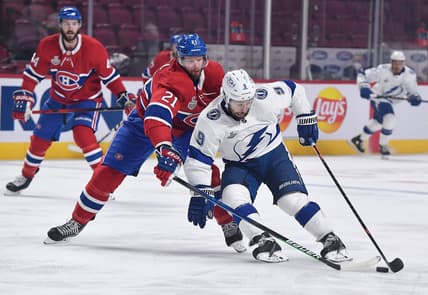 Jul 5, 2021; Montreal, Quebec, CAN; Tampa Bay Lightning center Tyler Johnson (9) controls the puck as Montreal Canadiens center Eric Staal (21) defends during the first period in game four of the 2021 Stanley Cup Final at the Bell Centre. Mandatory Credit: Eric Bolte-USA TODAY Sports