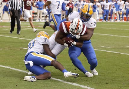 Oct 16, 2021; Blacksburg, Virginia, USA;  Virginia Tech Hokies running back Raheem Blackshear (5) is tackled by Pittsburgh Panthers defensive back Erick Hallett (31) and linebacker Wendell Davis (20) during the first quarter at Lane Stadium. Mandatory Credit: Reinhold Matay-USA TODAY Sports