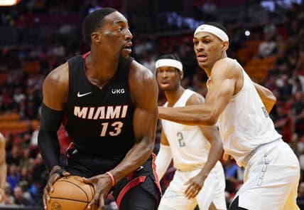Mar 18, 2022; Miami, Florida, USA; Oklahoma City Thunder forward Darius Bazley (7) defends Miami Heat center Bam Adebayo (13) during the first half at FTX Arena. Mandatory Credit: Jim Rassol-USA TODAY Sports