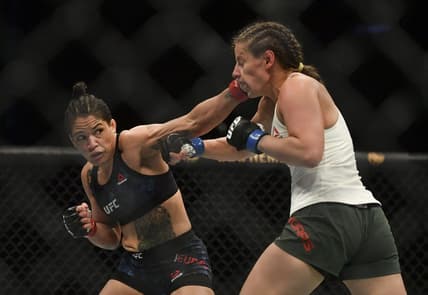 May 13, 2020; Jacksonville, Florida, USA; Sijara Eubanks (red gloves) fights Sarah Moras (blue gloves) during UFC Fight Night at VyStar Veterans Memorial Arena. Mandatory Credit: Jasen Vinlove-USA TODAY Sports