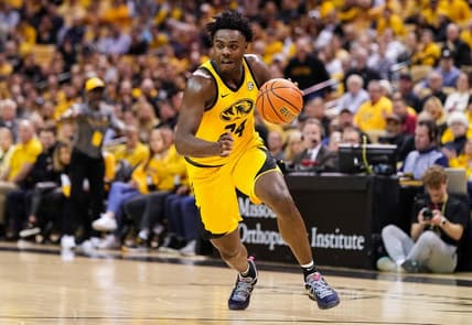 Jan 18, 2023; Columbia, Missouri, USA; Missouri Tigers guard Kobe Brown (24) dribbles the ball during the first half against the Arkansas Razorbacks at Mizzou Arena. Mandatory Credit: Jay Biggerstaff-USA TODAY Sports