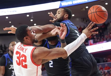 Feb 8, 2023; Houston, Texas, USA;Houston Cougars forward Reggie Chaney (32) passes against Tulsa Golden Hurricane guard Sterling Gaston-Chapman (3) in the first half at Fertitta Center. Mandatory Credit: Thomas Shea-USA TODAY Sports