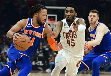 Mar 31, 2023; Cleveland, Ohio, USA; New York Knicks guard Jalen Brunson (11) drives to the basket against Cleveland Cavaliers guard Donovan Mitchell (45) during the first half at Rocket Mortgage FieldHouse. Mandatory Credit: Ken Blaze-USA TODAY Sports