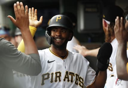 Aug 10, 2023; Pittsburgh, Pennsylvania, USA; Pittsburgh Pirates left fielder Josh Palacios (54) high-fives in the dugout after scoring a run against the Atlanta Braves during the third inning at PNC Park. Mandatory Credit: Charles LeClaire-USA TODAY Sports