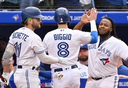 Sep 16, 2023; Toronto, Ontario, CAN; Toronto Blue Jays pinch runner Cavan Biggio (8) celebrates with shortstop Bo Bichette (11) and first baseman Vladimir Guerrero Jr. (27) after scoring against the Boston Red Sox in the ninth inning at Rogers Centre. Mandatory Credit: Dan Hamilton-USA TODAY Sports
