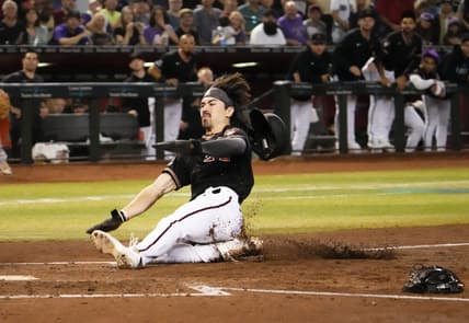 Sep 19, 2023; Phoenix, AZ, USA; Arizona Diamondbacks Corbin Carroll (7) scores on a throwing error by San Francisco Giants catcher Patrick Bailey (14) after stealing third base in the second inning at Chase Field. Mandatory Credit: Rob Schumacher-Arizona Republic