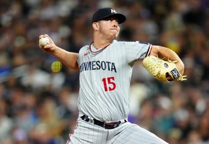 Sep 29, 2023; Denver, Colorado, USA; Minnesota Twins relief pitcher Emilio Pagan (15) delivers a pitch in the ninth inning against the Colorado Rockies at Coors Field. Mandatory Credit: Ron Chenoy-USA TODAY Sports