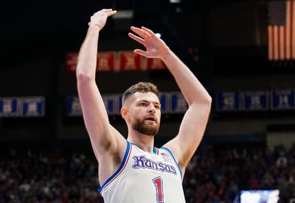 Dec 1, 2023; Lawrence, Kansas, USA; Kansas Jayhawks center Hunter Dickinson (1) celebrates during the first half against the Connecticut Huskies at Allen Fieldhouse. Mandatory Credit: Jay Biggerstaff-USA TODAY Sports