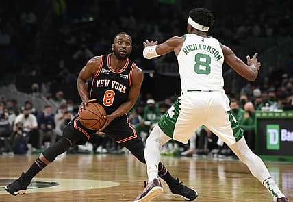 Dec 18, 2021; Boston, Massachusetts, USA;  New York Knicks guard Kemba Walker (8) controls the ball while Boston Celtics guard Josh Richardson (8) defends during the first half at TD Garden. Mandatory Credit: Bob DeChiara-USA TODAY Sports