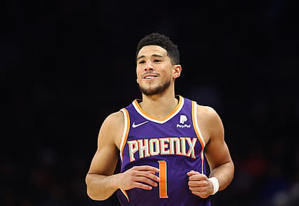 Dec 19, 2021; Phoenix, Arizona, USA; Phoenix Suns guard Devin Booker (1) against the Charlotte Hornets in the first half at Footprint Center. Mandatory Credit: Mark J. Rebilas-USA TODAY Sports