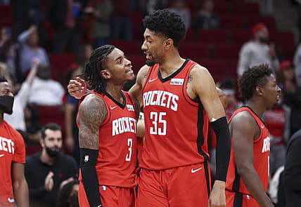Nov 27, 2021; Houston, Texas, USA; Houston Rockets guard Kevin Porter Jr. (3) and center Christian Wood (35) react after a play during overtime against the Charlotte Hornets at Toyota Center. Mandatory Credit: Troy Taormina-USA TODAY Sports
