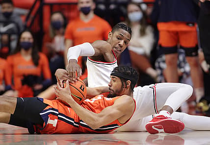 Feb 24, 2022; Champaign, Illinois, USA;  Ohio State Buckeyes guard Eugene Brown III (3) wrestles for the ball with Illinois Fighting Illini forward Jacob Grandison (3) during the first half  at State Farm Center. Mandatory Credit: Ron Johnson-USA TODAY Sports