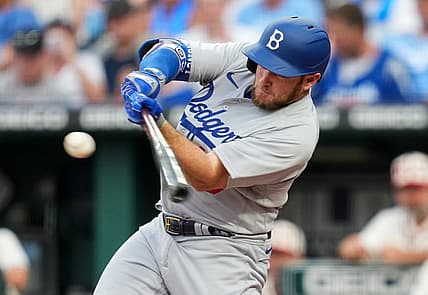 Aug 13, 2022; Kansas City, Missouri, USA; Los Angeles Dodgers third baseman Max Muncy (13) hits a home run against the Kansas City Royals during the fourth inning at Kauffman Stadium. Mandatory Credit: Jay Biggerstaff-USA TODAY Sports