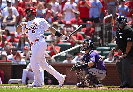 Aug 18, 2022; St. Louis, Missouri, USA;  St. Louis Cardinals pinch hitter Albert Pujols (5) hits a grand slam for his 690th career home run against the Colorado Rockies during the third inning at Busch Stadium. Mandatory Credit: Jeff Curry-USA TODAY Sports