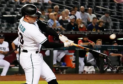 Sep 1, 2022; Phoenix, Arizona, USA; Arizona Diamondbacks first baseman Christian Walker (53) hits a 2-run home run off Milwaukee Brewers starting pitcher Brandon Woodruff (53) in the first inning at Chase Field. Mandatory Credit: Rob Schumacher-Arizona Republic

Mlb Brewers At Diamondbacks