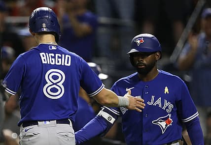 Sep 2, 2022; Pittsburgh, Pennsylvania, USA;  Toronto Blue Jays first baseman Cavan Biggio (8) celebrates with right fielder Jackie Bradley Jr. (right) after scoring a run against the Pittsburgh Pirates during the fourth inning at PNC Park. Mandatory Credit: Charles LeClaire-USA TODAY Sports