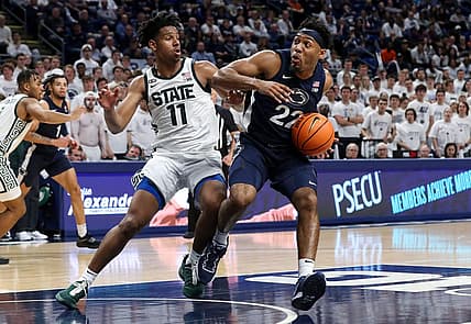 Dec 7, 2022; University Park, Pennsylvania, USA; Penn State Nittany Lions guard Jalen Pickett (22) drives the ball towards the basket as Michigan State Spartans guard AJ Hoggard (11) defends during the first half at Bryce Jordan Center. Mandatory Credit: Matthew OHaren-USA TODAY Sports