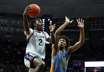 Dec 10, 2022; Storrs, Connecticut, USA; UConn Huskies guard Tristen Newton (2) shoots against Long Island Sharks forward/center C.J. Delancy (15) in the first half at Harry A. Gampel Pavilion. Mandatory Credit: David Butler II-USA TODAY Sports