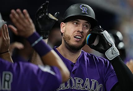 Jul 21, 2023; Miami, Florida, USA;  Colorado Rockies first baseman C.J. Cron (25) is congratulated after hitting a two-run home run in the first inning against the Miami Marlins at loanDepot Park. Mandatory Credit: Jim Rassol-USA TODAY Sports