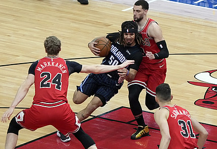 Apr 14, 2021; Chicago, Illinois, USA; Orlando Magic guard Cole Anthony (50) drives to the basket against Chicago Bulls guard Zach LaVine (8) during the second quarter at the United Center. Mandatory Credit: Mike Dinovo-USA TODAY Sports