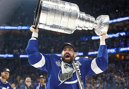Jul 7, 2021; Tampa, Florida, USA;  Tampa Bay Lightning left wing Alex Killorn (17) hoists the Stanley Cup after the Lightning defeated the Montreal Canadiens 1-0 in game five to win the 2021 Stanley Cup Final at Amalie Arena. Mandatory Credit: Kim Klement-USA TODAY Sports