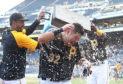 Aug 29, 2021; Pittsburgh, Pennsylvania, USA;  Pittsburgh Pirates relief pitcher Duane Underwood Jr. (left) and left fielder Anthony Alford (right) dump ice water on right fielder Yoshi Tsutsugo (32) after Tsuitsugo hit a game winning walk-off three run home run to defeat the St. Louis Cardinals at PNC Park. The Pirates won 4-3. Mandatory Credit: Charles LeClaire-USA TODAY Sports