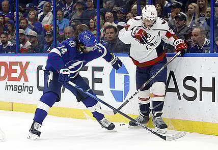 Nov 1, 2021; Tampa, Florida, USA;Tampa Bay Lightning left wing Pat Maroon (14) and Washington Capitals defenseman John Carlson (74) skates with the puck during the first quarter at Amalie Arena. Mandatory Credit: Kim Klement-USA TODAY Sports
