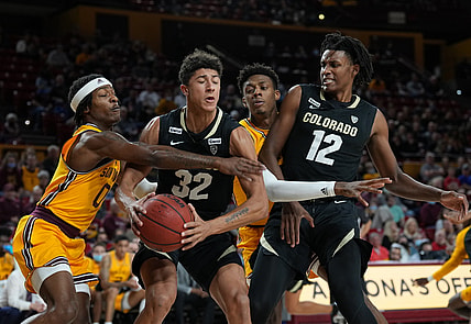Jan 15, 2022; Tempe, Arizona, USA; Arizona State Sun Devils guard DJ Horne (0) defends against Colorado Buffaloes guard Nique Clifford (32) during the first half at Desert Financial Arena. Mandatory Credit: Joe Camporeale-USA TODAY Sports