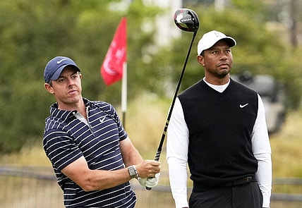 Jul 11, 2022; St. Andrews, SCT; Rory McIlroy and Tiger Woods during the R&A Celebration of Champions four-hole challenge at the 150th Open Championship golf tournament at St. Andrews Old Course. Mandatory Credit: Rob Schumacher-USA TODAY Sports