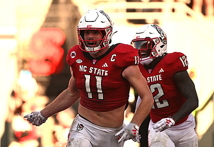 Oct 28, 2023; Raleigh, North Carolina, USA; North Carolina State Wolfpack linebacker Payton Wilson (11) celebrates after scoring a touchdown on an interception during the second half against the Clemson Tigers at Carter-Finley Stadium. Mandatory Credit: Rob Kinnan-USA TODAY Sports
