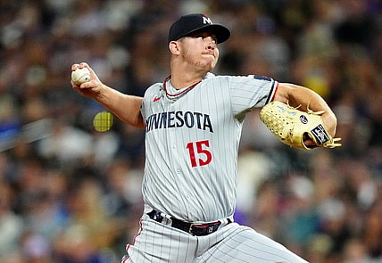 Sep 29, 2023; Denver, Colorado, USA; Minnesota Twins relief pitcher Emilio Pagan (15) delivers a pitch in the ninth inning against the Colorado Rockies at Coors Field. Mandatory Credit: Ron Chenoy-USA TODAY Sports
