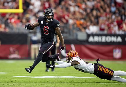 Oct 8, 2023; Glendale, Arizona, USA; Arizona Cardinals running back James Conner (6) against diving Cincinnati Bengals cornerback Cam Taylor-Britt at State Farm Stadium. Mandatory Credit: Mark J. Rebilas-USA TODAY Sports