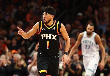 Nov 15, 2023; Phoenix, Arizona, USA; Phoenix Suns guard Devin Booker (1) reacts against the Minnesota Timberwolves in the second half at Footprint Center. Mandatory Credit: Mark J. Rebilas-USA TODAY Sports